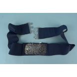 A nurses belt with silver buckle,