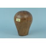 A vintage wooden head (hat block),