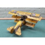 A metal model of a tri-plane fighter