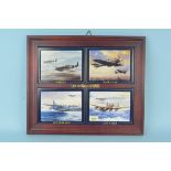 A set of four titled 'The Magnificent Four' WWII aircraft depicted on ceramic plaques within