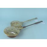 An antique childs brass warming pan with punched and pierced decoration and shaped iron handle plus