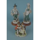 A pair of Italian figurines marked 'Belconi' plus a German figure group