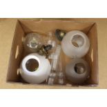 A box of mixed oil lamp parts including burners,