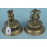 A pair of heavy antique bronze candlesticks in the Renaissance style with grotesque mask handles