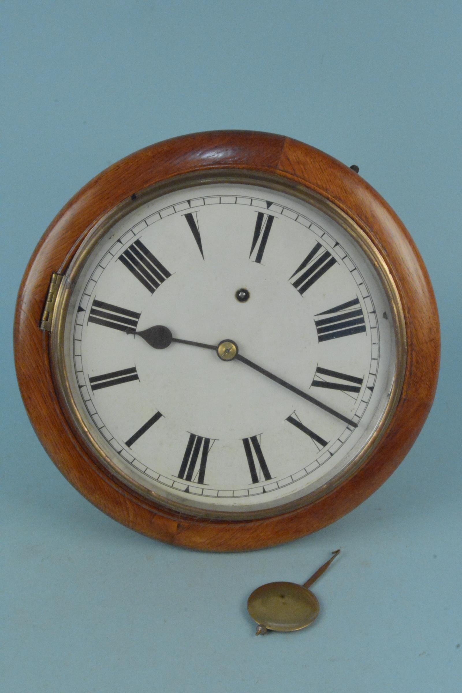A vintage wooden cased W & H Sch (Winterhalder & Hofmeir of Schwarzenbach) wall clock with pendulum