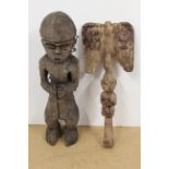 A vintage African carved wooden figure plus one other (both very weathered)