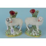 A pair of Staffordshire ram and ewe spill holders
