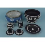Six pieces of Wedgwood black Jasperware including a fruit bowl and candlesticks plus a Wedgwood
