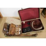 Two vintage cased vanity/grooming sets,