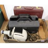 A vintage Noris slide projector, a Sony Trinicon video camera with case,