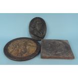 Two early 20th Century plaster wall plaques of profile heads plus an oak framed carved soapstone