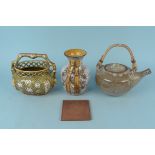 An Aylesbury pottery teapot, a green glazed handled basket,