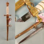 A second model Navy (Kriegsmarine) Officer's dress dagger by W.K.C. with its lightning scabbard.