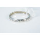 A platinum band with engraved decoration, size M, weight approx 2.