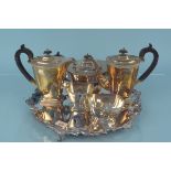 A silver plated five piece tea and coffee set with Celtic design banding together with a large