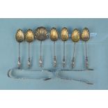 A set of six silver apostle teaspoons with matching tongs and sifter,