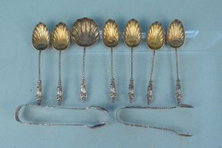 A set of six silver apostle teaspoons with matching tongs and sifter,