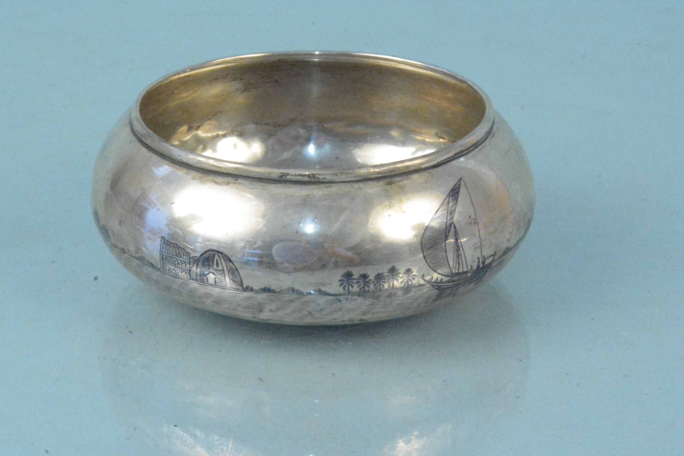 A white metal Niello decorated bowl (dented),