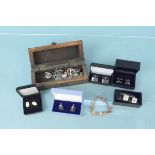 A collection of silver and costume cufflinks