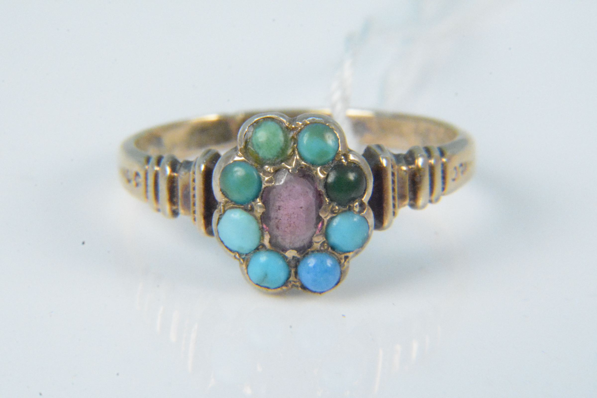 A yellow metal turquoise and amethyst set ring, size M, weight approx 2.