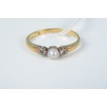 An 18ct gold single pearl and white stone set ring, size J, weight approx 1.