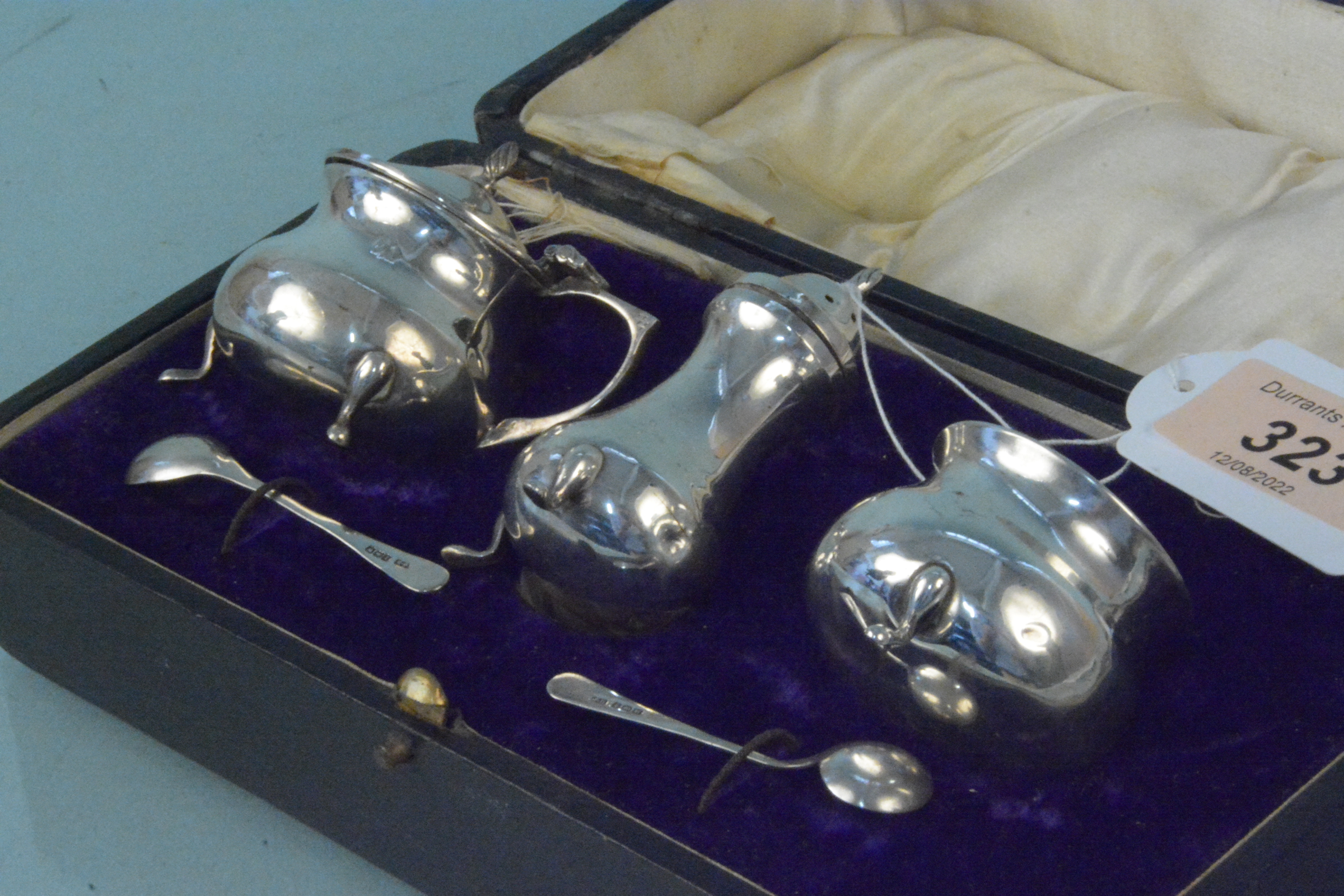A cased three piece cruet set with associated spoons, - Image 2 of 3