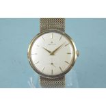 A c1960's Zenith 9ct gold gents wristwatch, mesh style bracelet with champagne coloured dial,