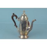 A silver coffee pot, wood handle hallmarked Birmingham 1970, maker Poston Products Ltd,
