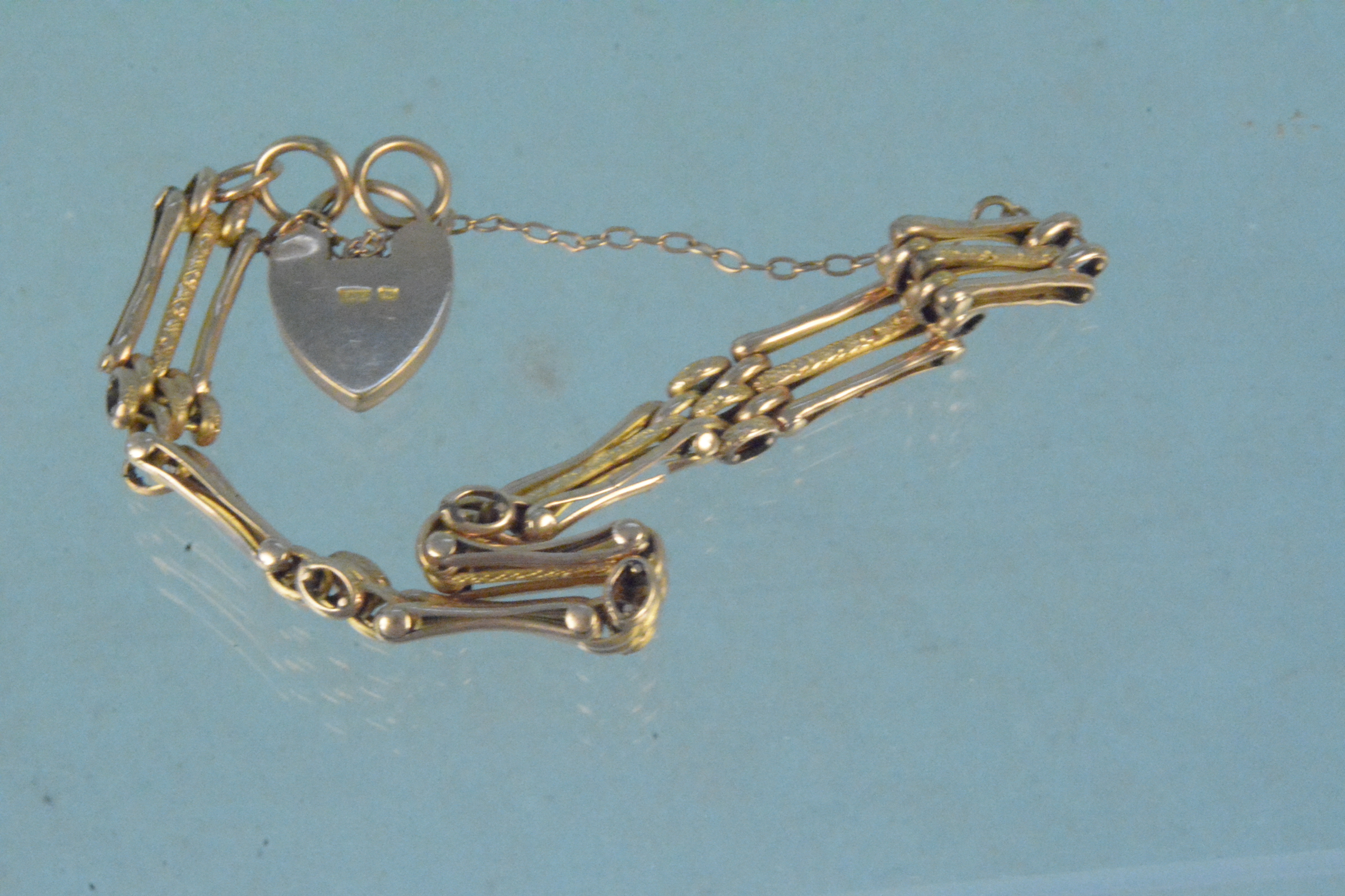 A yellow metal gate link bracelet with 9ct gold padlock clasp, - Image 2 of 3