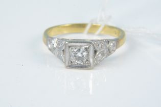 An 18ct gold diamond solitaire ring, the round cut diamond in square setting, size N,