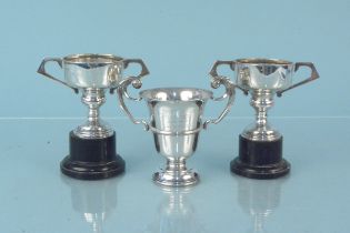 Three small silver trophies, two are uninscribed,