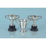 Three small silver trophies, two are uninscribed,