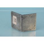 A silver cigarette case with inscription to front, hallmarked Birmingham 1912,