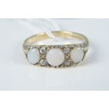 A 9ct gold opal and white stone set ring, size M 1/2, weight approx 2.