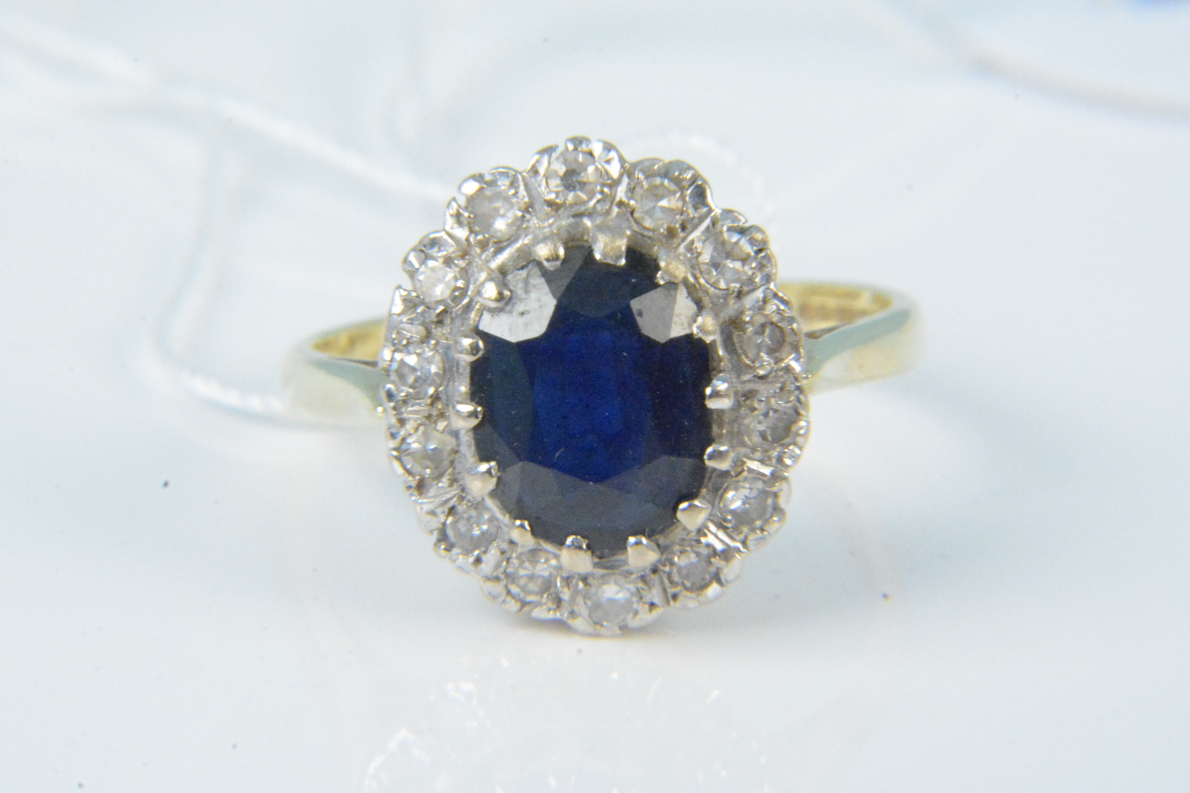 An 18ct gold sapphire and diamond cluster ring, size N, weight approx 4.