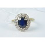 An 18ct gold sapphire and diamond cluster ring, size N, weight approx 4.