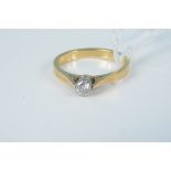 An 18ct gold solitaire diamond ring, size K,