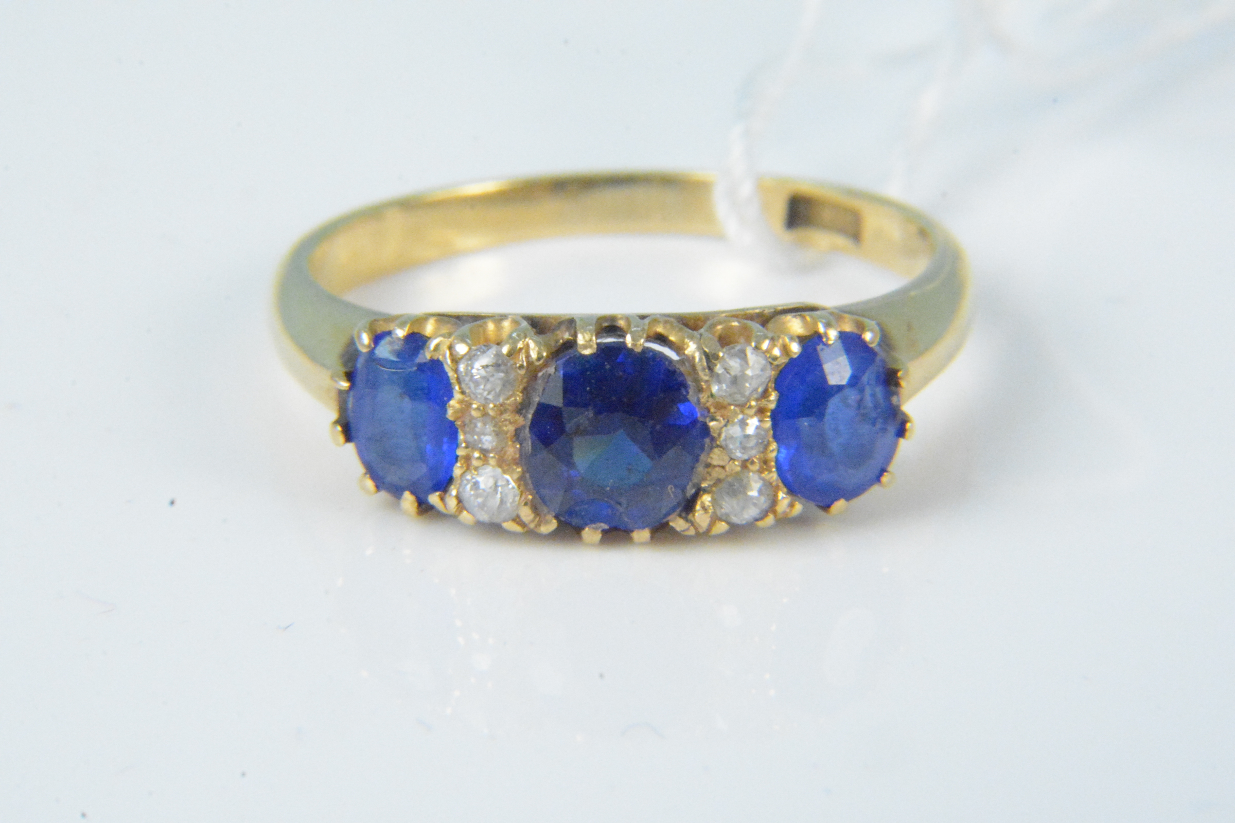 An 18ct gold sapphire and diamond ring,