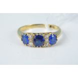 An 18ct gold sapphire and diamond ring,