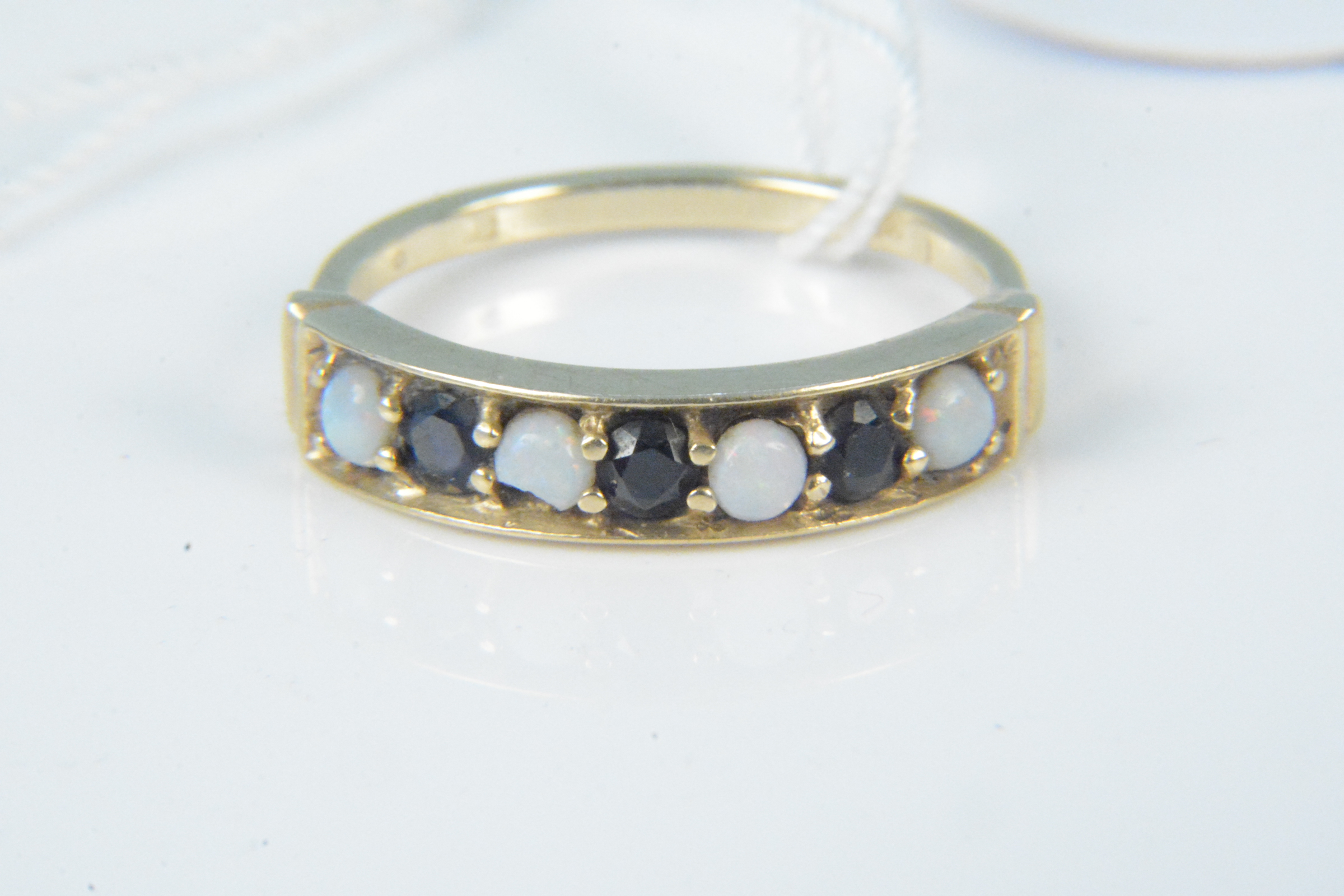 A 9ct gold opal and sapphire set ring, size N,