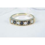 A 9ct gold opal and sapphire set ring, size N,