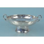 A silver twin handled bowl on large flared pedestal base, hallmarked Sheffield 1924,