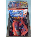 A boxed Spiderman Flip 'n' Trap playset together with other Spiderman and Superman vehicles and