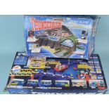 A c1990's boxed Thunderbirds Tracy Island together with a 'Tomy Train 4' model train set