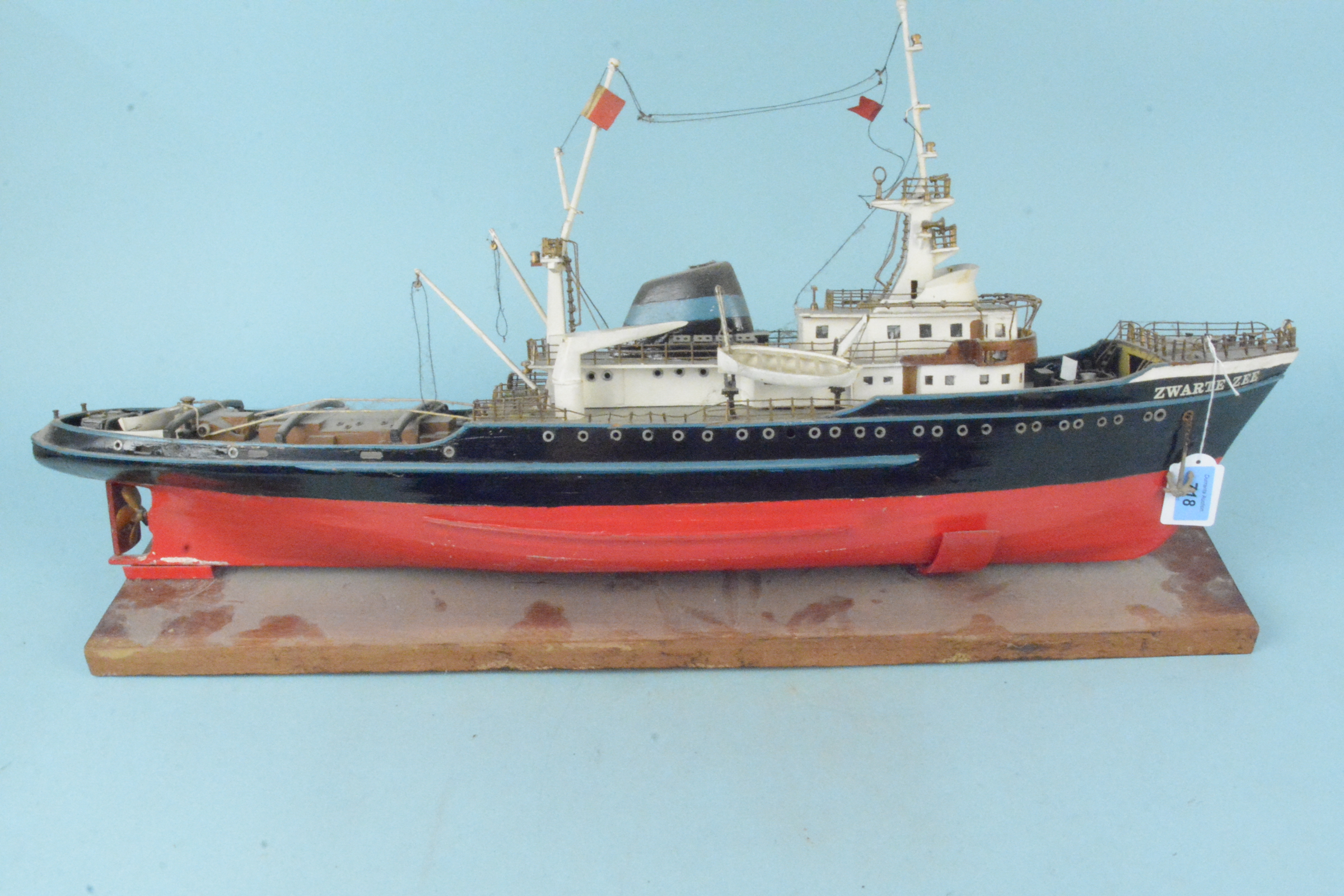 A large wooden model, probably Billing Boats, of the tug boat 'Zwarte-Zee',