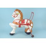 A vintage 'Mobo' tin plate childs walker horse (repainted and playworn)