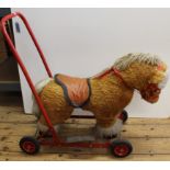 A vintage childs push along horse (mild wear but good for its age)