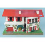 A small vintage wood construction and painted doll's house,