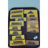 Three boxed Arnold Rapido vintage N gauge engines together with twelve boxed tenders and carriages