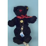 A Steiff classic mohair growler bear with button and labels